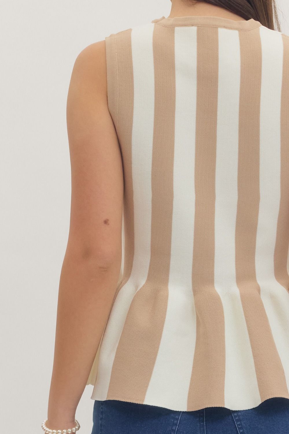 Striped sleeveless peplum knit top